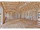 Spacious, unfinished interior with wood framing, presenting endless possibilities for a custom home design at 143 Tranquility Ln, Harmony, NC 28634