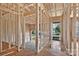 A view inside reveals the framework for doorways and rooms, offering a sense of layout and design possibilities at 143 Tranquility Ln, Harmony, NC 28634