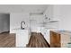 White kitchen with a large island and stainless steel appliances at 143 Tranquility Ln, Harmony, NC 28634