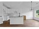 Bright kitchen with an island, stainless steel appliances, and hardwood floors at 143 Tranquility Ln, Harmony, NC 28634