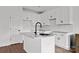 Modern kitchen with stainless appliances, center island, and white cabinetry at 143 Tranquility Ln, Harmony, NC 28634