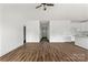 Open-concept living room with hardwood floors and neutral decor at 143 Tranquility Ln, Harmony, NC 28634