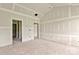 An open-concept living room displaying multiple doorways and drywall ready for paint and trim at 143 Tranquility Ln, Harmony, NC 28634