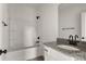 Bright bathroom with granite vanity top, framed mirror, and a shower-tub combination at 149 Tranquility Ln, Harmony, NC 28634
