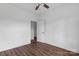 Bright bedroom featuring wood-look floors, a ceiling fan, and ample doorway access at 149 Tranquility Ln, Harmony, NC 28634
