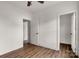 A cozy bedroom with neutral walls, wood-look flooring, and two closets at 149 Tranquility Ln, Harmony, NC 28634