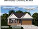 Exterior view showcases the home's indigo siding, jute brown doors and shutters, and aspen white trim at 149 Tranquility Ln, Harmony, NC 28634