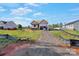 New home construction showing framing, brick base, and new residential neighborhood at 149 Tranquility Ln, Harmony, NC 28634