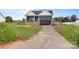 New construction home with navy siding and a front-facing garage ready for customization at 149 Tranquility Ln, Harmony, NC 28634