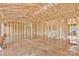 Spacious unfinished interior reveals the framework of a modern home design at 149 Tranquility Ln, Harmony, NC 28634