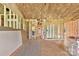 Unfinished interior showing wooden frame construction with insulation and exposed plywood subflooring at 149 Tranquility Ln, Harmony, NC 28634