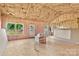 Unfinished interior showing wooden frame construction with insulation and exposed plywood subflooring at 149 Tranquility Ln, Harmony, NC 28634
