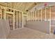 Unfinished interior showing wooden frame construction with insulation and exposed plywood subflooring at 149 Tranquility Ln, Harmony, NC 28634