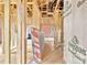 Unfinished interior showing wooden frame construction with insulation and exposed plywood subflooring at 149 Tranquility Ln, Harmony, NC 28634