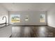 Light and airy kitchen with granite countertops, wood flooring, and stainless-steel appliances at 149 Tranquility Ln, Harmony, NC 28634