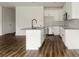 A modern kitchen with white cabinets, granite countertops, and stainless-steel appliances at 149 Tranquility Ln, Harmony, NC 28634