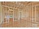 Unfinished living room featuring open-concept layout, wood framing and a view of the outdoors at 149 Tranquility Ln, Harmony, NC 28634