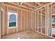 Framed room features a pre-installed window with a view of the green grass and other houses at 149 Tranquility Ln, Harmony, NC 28634