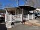 Park model home with covered porch and deck at 168 Clubhouse Dr, New London, NC 28127