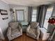 Cozy living area with two armchairs and decorative accents at 168 Clubhouse Dr, New London, NC 28127