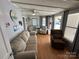 Bright living room with comfortable seating and lake decor at 168 Clubhouse Dr, New London, NC 28127