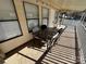 Covered patio with table and chairs, ideal for outdoor dining at 168 Clubhouse Dr, New London, NC 28127