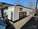 Vintage camper with stars and stripes at 168 Clubhouse Dr, New London, NC 28127