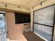 Outdoor TV area on deck with shelf at 168 Clubhouse Dr, New London, NC 28127