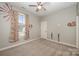 Charming bedroom with a window featuring floral curtains and wall art at 1719 Kelley Lake Dr, York, SC 29745