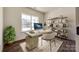 Bright home office with built-in shelving and large window at 18011 Wilbanks Rd, Charlotte, NC 28278