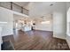 Open-concept living room flowing into modern kitchen, featuring stylish hardwood flooring at 18011 Wilbanks Rd, Charlotte, NC 28278