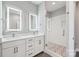 Double vanity bathroom with a walk-in shower at 1927 W Trade St, Charlotte, NC 28216