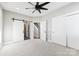 Bedroom with sliding barn door and carpet flooring at 1927 W Trade St, Charlotte, NC 28216