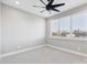Bright bedroom with ceiling fan and city view at 1927 W Trade St, Charlotte, NC 28216