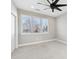 Well-lit bedroom featuring a ceiling fan and window at 1927 W Trade St, Charlotte, NC 28216