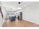 Modern kitchen with island, stainless steel appliances, and white cabinets at 1927 W Trade St, Charlotte, NC 28216