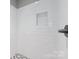 Shower with white subway tile and hexagon floor tile at 1927 W Trade St, Charlotte, NC 28216