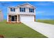 Two-story house with a two-car garage and landscaped lawn at 202 Brinkley Dr # 11, Kings Mountain, NC 28086