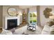 Bright living room features fireplace, sliding glass door to backyard, and ample natural light at 202 Brinkley Dr # 11, Kings Mountain, NC 28086