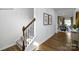 Elegant staircase with dark wood railing and carpeted steps at 202 Brinkley Dr # 11, Kings Mountain, NC 28086