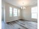 Spacious dining area with wood-look floors and large windows at 227 Hoskins Avenue Dr, Charlotte, NC 28208