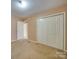 Bedroom with double door closet and carpet at 230 Spring Nw St, Concord, NC 28025