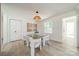 Bright dining area with glass table and white chairs at 2340 Westerly Hills Dr, Charlotte, NC 28208