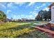 A spacious backyard of a new home in construction, featuring a tree line, green grass, and a partly constructed home at 244 Little Wilkesboro Rd, Harmony, NC 28634