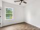 Cozy bedroom featuring natural light from the window, paired with modern flooring for a comfortable atmosphere at 244 Little Wilkesboro Rd, Harmony, NC 28634
