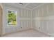 Unfinished bedroom displays a window with view and taped drywall at 244 Little Wilkesboro Rd, Harmony, NC 28634