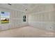 Bedroom with bare drywall, a large window for natural light, and high vaulted ceilings at 244 Little Wilkesboro Rd, Harmony, NC 28634