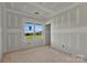 Unfinished bedroom displays a window with view and taped drywall at 244 Little Wilkesboro Rd, Harmony, NC 28634