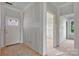Unfinished entryway displays taped drywall, door, and an unfinished floor at 244 Little Wilkesboro Rd, Harmony, NC 28634