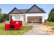 New construction home with a modern design, and a two-car garage is under construction at 244 Little Wilkesboro Rd, Harmony, NC 28634